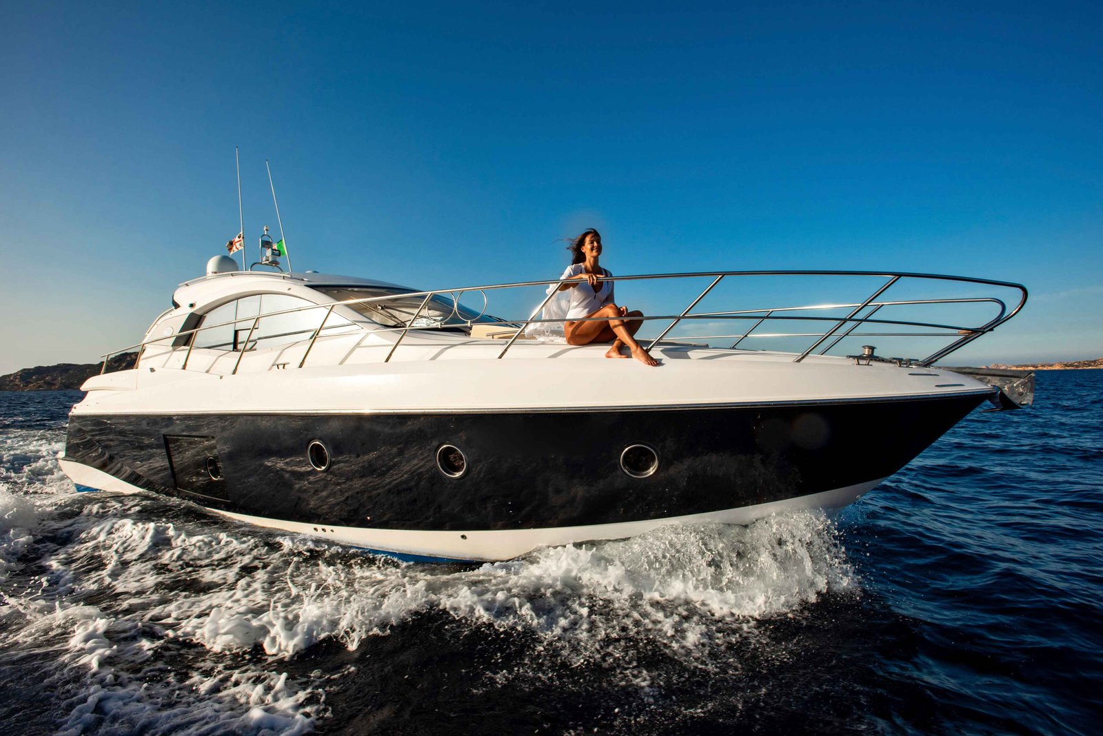 a person enjoying a sunny day on a sleek yacht
